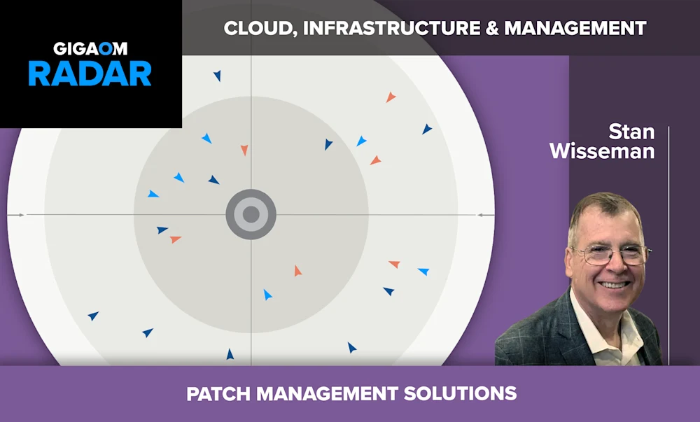 The image appears to be a slide from a presentation about cloud infrastructure and management, specifically focusing on patch management solutions. The slide has a dark purple background with the GigaOm logo and "RADAR" text in the top left corner.

The main visual on the slide is a circular diagram with various triangular shapes pointing inward, likely representing different aspects or components of patch management solutions. In the center of the circle is a target-like shape, possibly symbolizing the goal or focus of these solutions.

On the right side of the slide is a headshot photo of a smiling man with glasses, along with his name "Stan Wisseman" printed below. This suggests he is likely the presenter or an expert on the topic being discussed.

The bottom purple banner reads "PATCH MANAGEMENT SOLUTIONS" in all capital letters, clearly identifying the specific subject matter of this presentation slide within the broader context of cloud infrastructure and management.