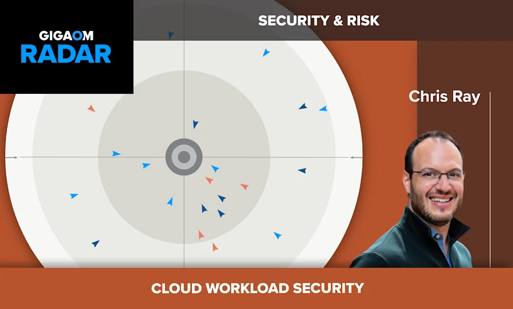 The image shows a slide from a presentation titled "Cloud Workload Security". It depicts a circular radar or sonar-like diagram with various triangular icons pointing inward, likely representing security risks or threats to cloud workloads coming from different directions.

In the bottom right is a headshot photo of a smiling man with short dark hair and glasses, identified as "Chris Ray" based on the text below his photo. He appears to be the presenter or an expert speaking about cloud security and risk topics.

The overall color scheme uses shades of orange, gray and white. The GigaOm Radar logo is shown in the top left corner, suggesting this is from a GigaOm industry research presentation or report related to evaluating cloud security solutions and the risks they aim to mitigate.