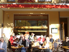 Brel - outside view with relaxing people