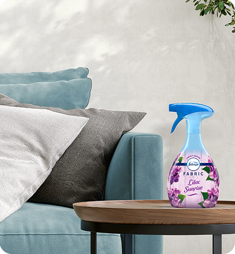 Febreze FABRIC lilac sunrise sitting on a living room side table