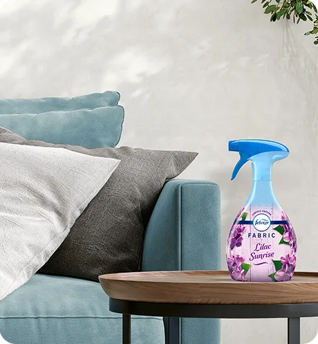Febreze FABRIC lilac sunrise sitting on a living room side table