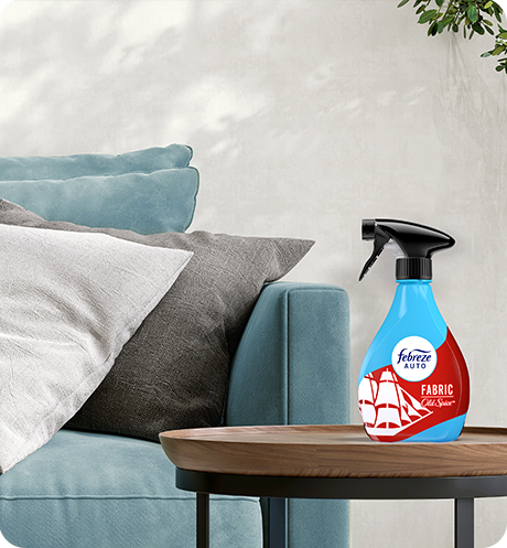 Bottle of Fabric Old Spice on a living room side table.