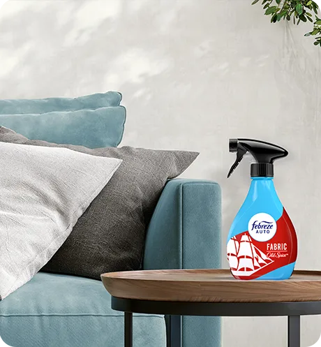 Bottle of Fabric Old Spice on a living room side table.