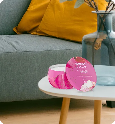 Romance & Desire candle sitting on a table