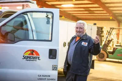 Person gesturing you to join as getting into a truck