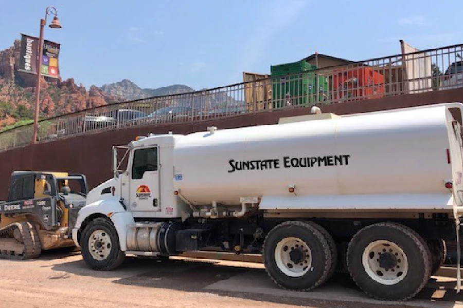 A water truck parked at the Sunstate lot, available for rent