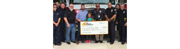 Large check donated to Emma Anne's Gifts by DFW Metro