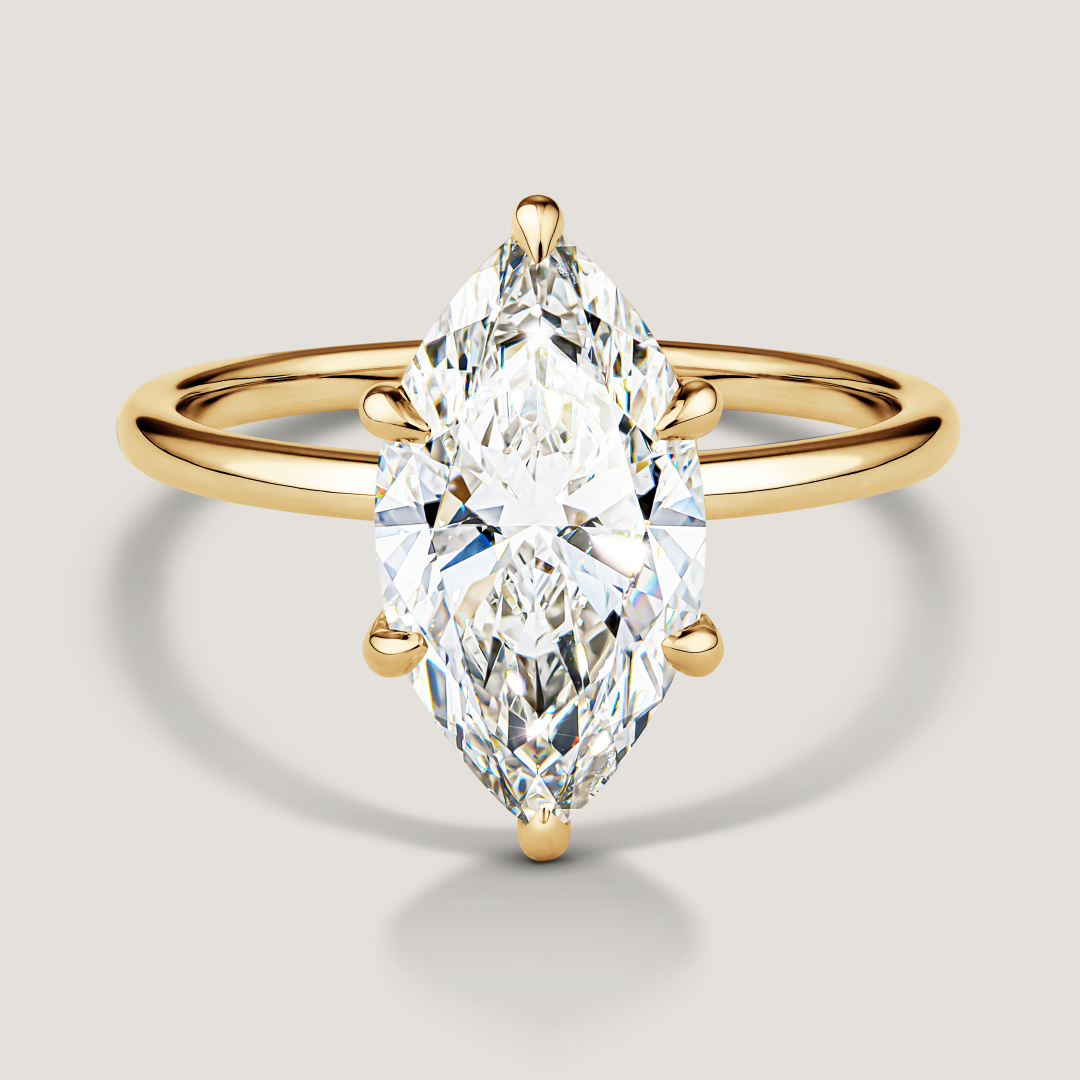 Yellow gold ring with a large marquise-shaped diamond