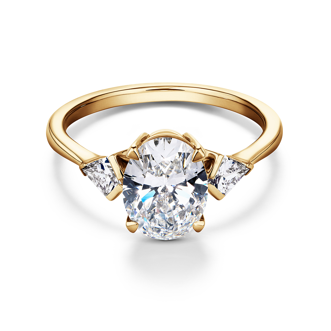 gold ring with oval diamond centre stone