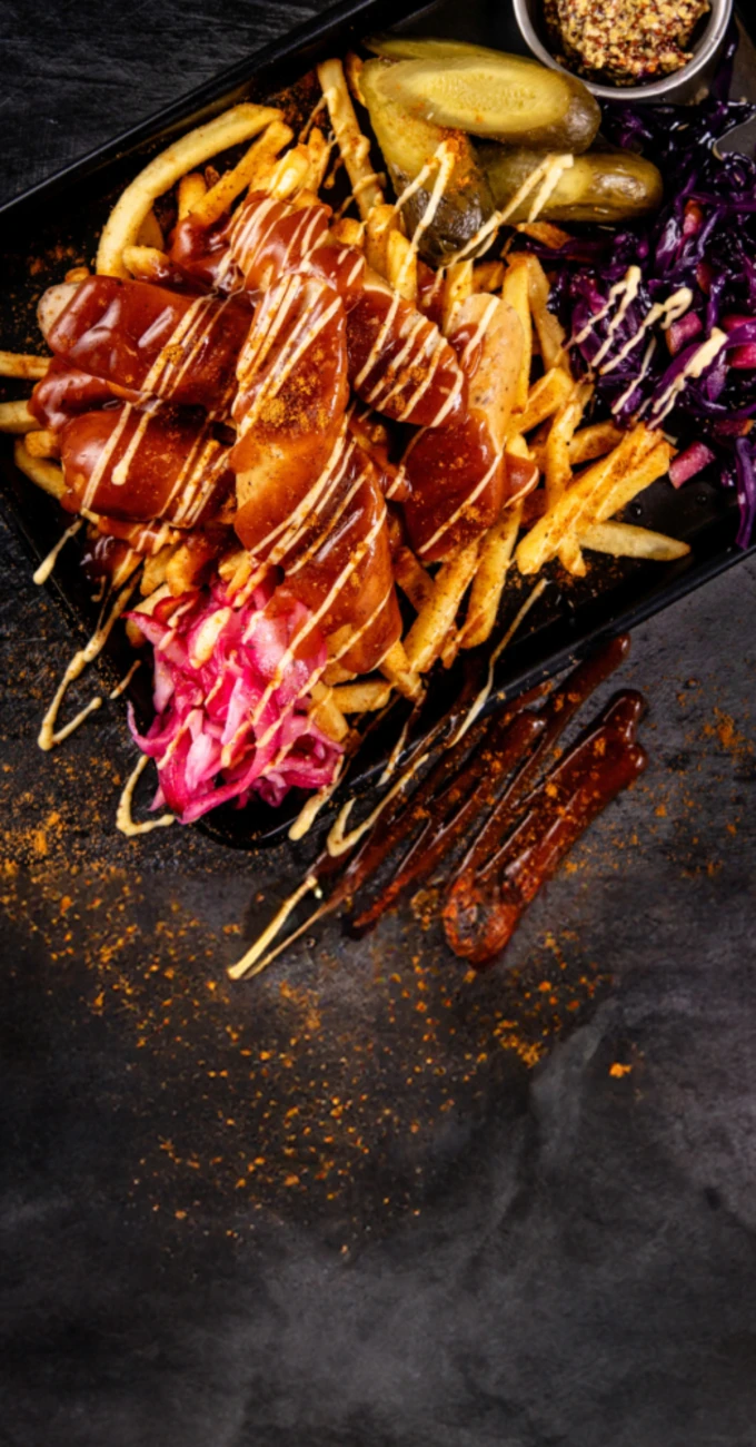 Tray of food including Quorn, fries, gherkins and cabbage