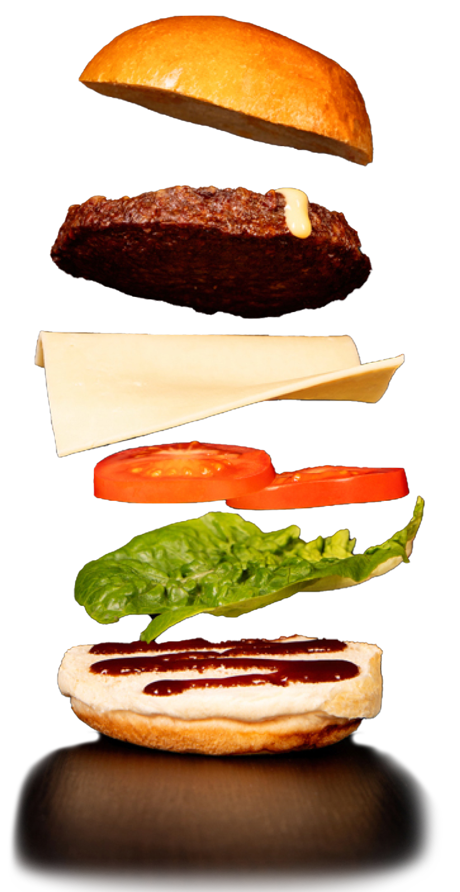 A Quorn burgers ingredients being seperated including tomato, cheese, lettuce and Quorn burgers