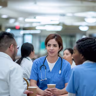 A group of medical personnel in medical scrubs