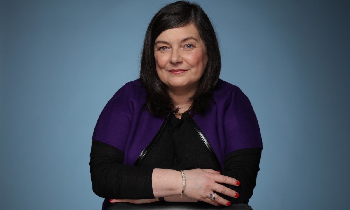 a person in purple sweater