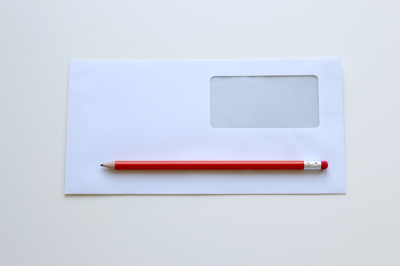 a red pen on a white surface