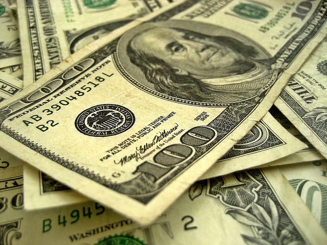 a close-up of a stack of paper money