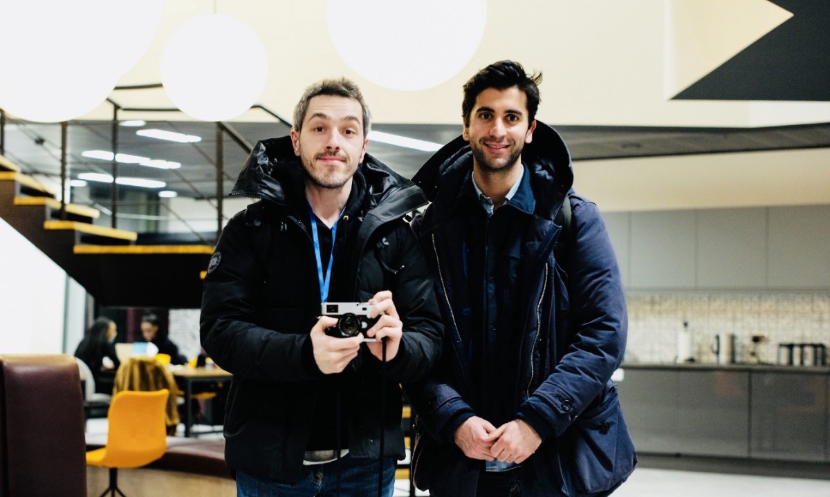 a couple of men holding cameras