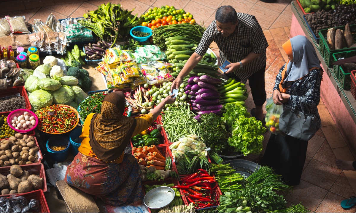 a person selling vegetables