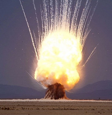 a large explosion in a desert