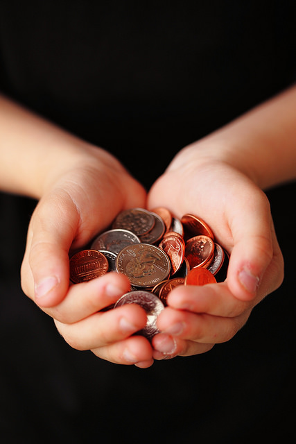 a person holding coins