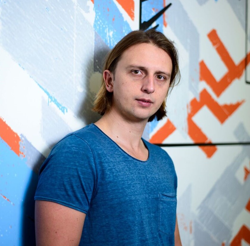 a person standing in front of a whiteboard