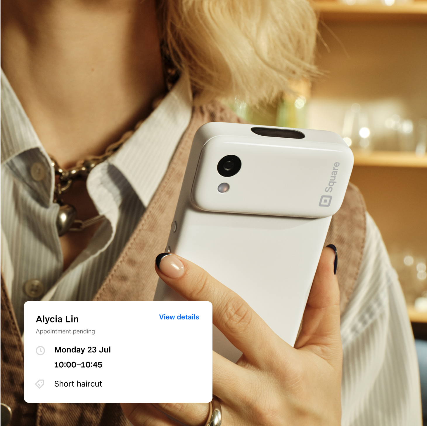 Person with their Square Handheld. 