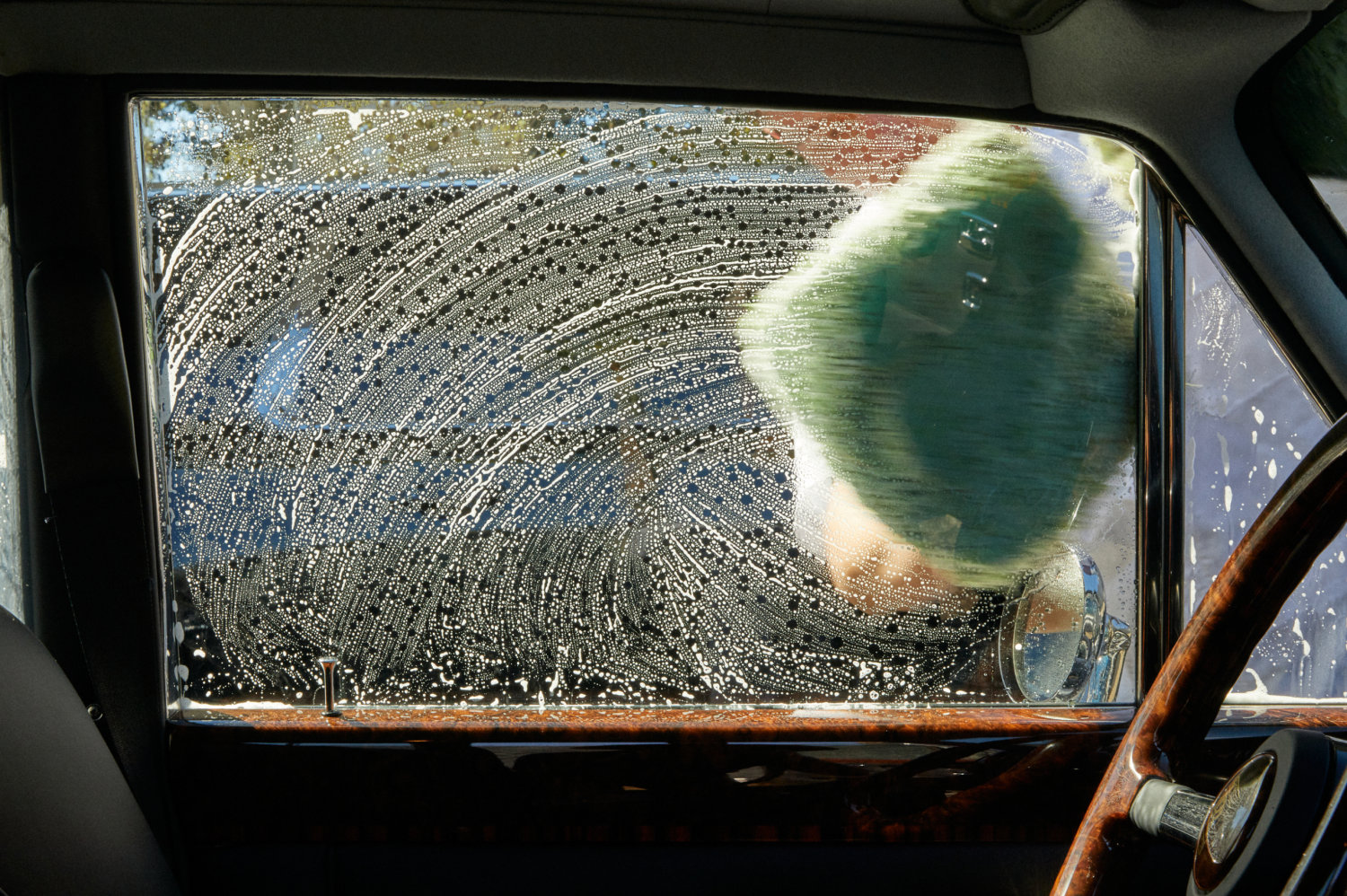 Interior view of a window being washed