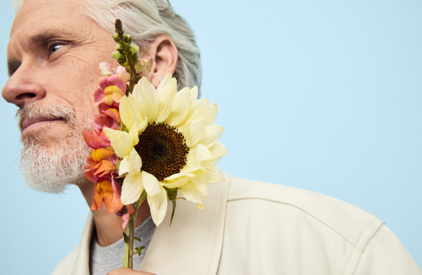 Man holding a bouquet of flowers