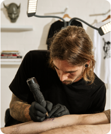 Man giving a tattoo