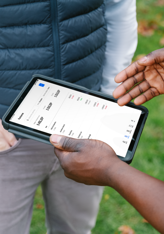 Close up of a hand holding a phone with the invoices paid details screen.