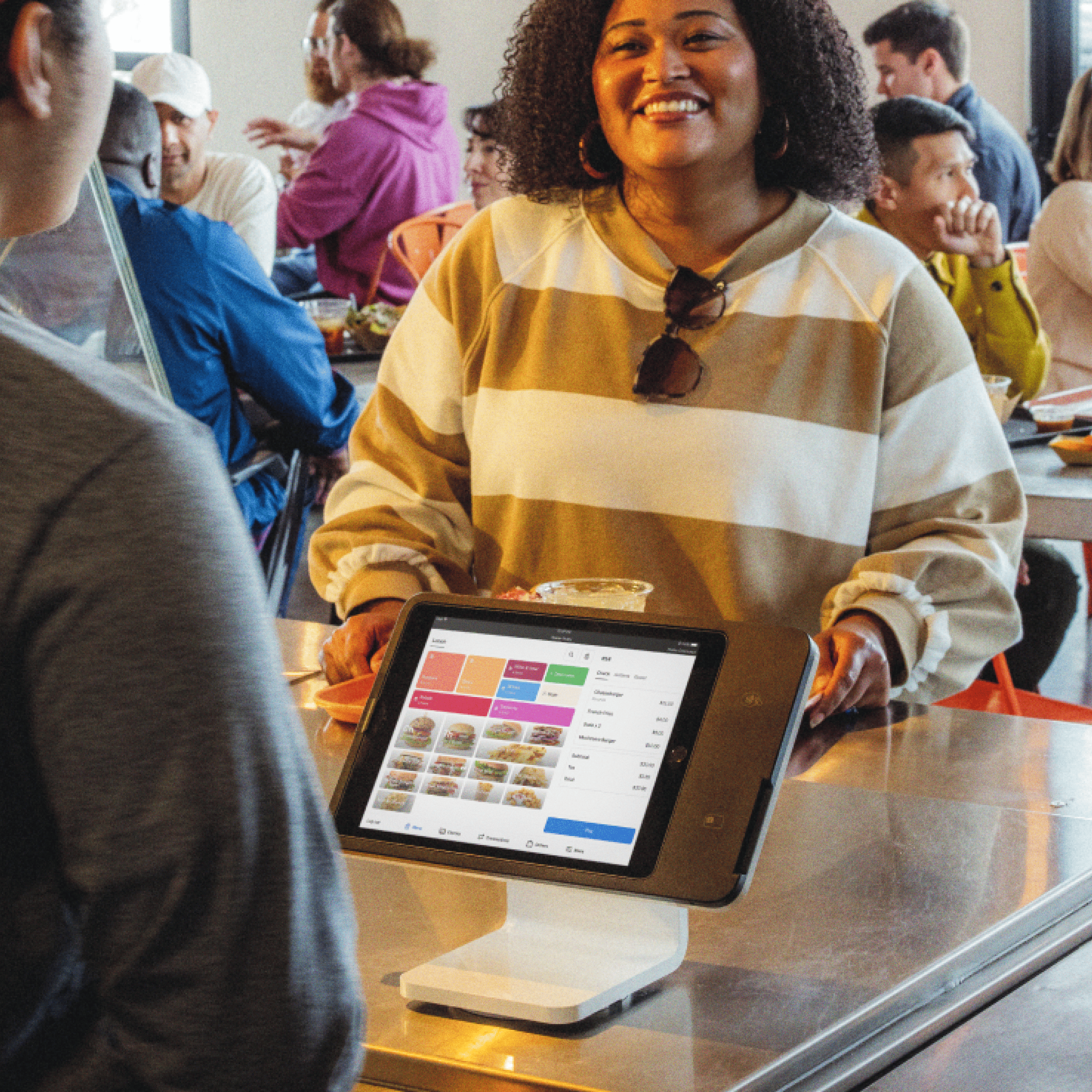 Square Stand at a restaurant counter with a food menu on its iPad