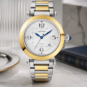 Shop Cartier Pasha watches: crown cap design, 30mm to 41mm sizes, in-house automatics, and how they compare to Santos.