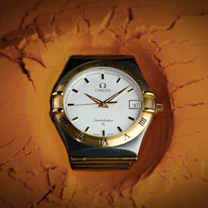 Stargaze from a Parisian balcony with the Omega Constellation watch. Discover cosmic charm and elegance on your wrist.