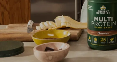 Multi Protein Powder Plant-Based Chocolate on a kitchen counter