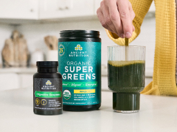 supergreens and digestive enzymes on a kitchen counter