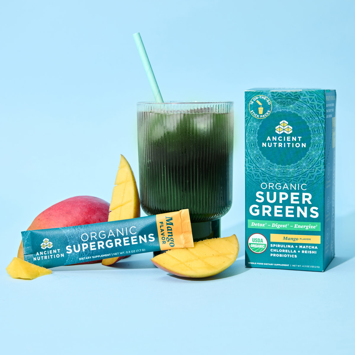Organic SuperGreens Mango stick packs with drink