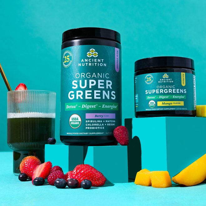 supergreens mango and berry bottles on a teal background