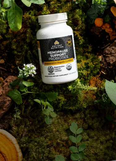 menopause support probiotics on a tree log