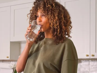 a woman sipping water