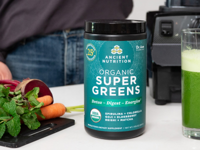 bottle of organic supergreens on a kitchen counter