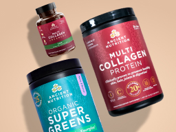 Bottles of New Ancient Nutrition Organic SuperGreens Berry, Multi Collagen Advanced Lean, and Multi Collagen Protein with a scoop of powder on a tan background