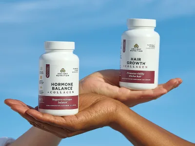 collagen for women bottles in the palm of two peoples hands