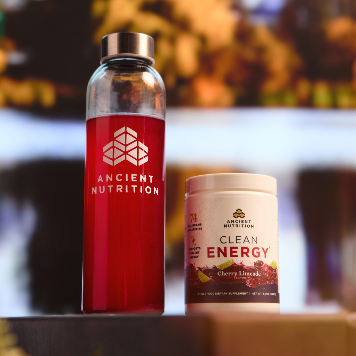 a water bottle with ancient nutrition clean energy powder in it