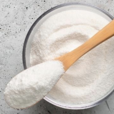 white powder with wooden spoon