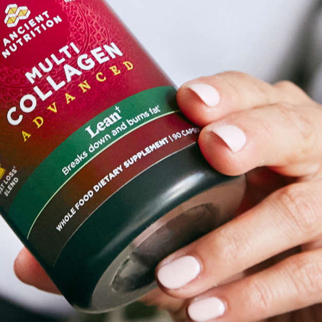 a person holding a bottle of multi collagen advanced lean capsules