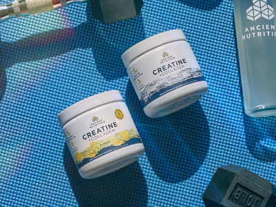 Creatine + Collagen on a workout mat