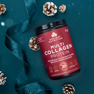 a bottle of Multi Collagen Protein powder pure on a dark blue background with ribbons and pinecones