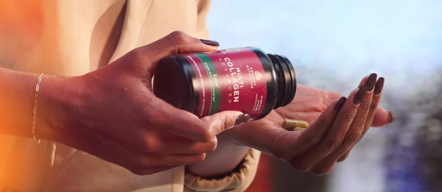 a person taking multi collagen advanced lean capsules