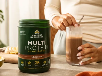 a bottle of Multi Protein plant next to a chocolate protein drink