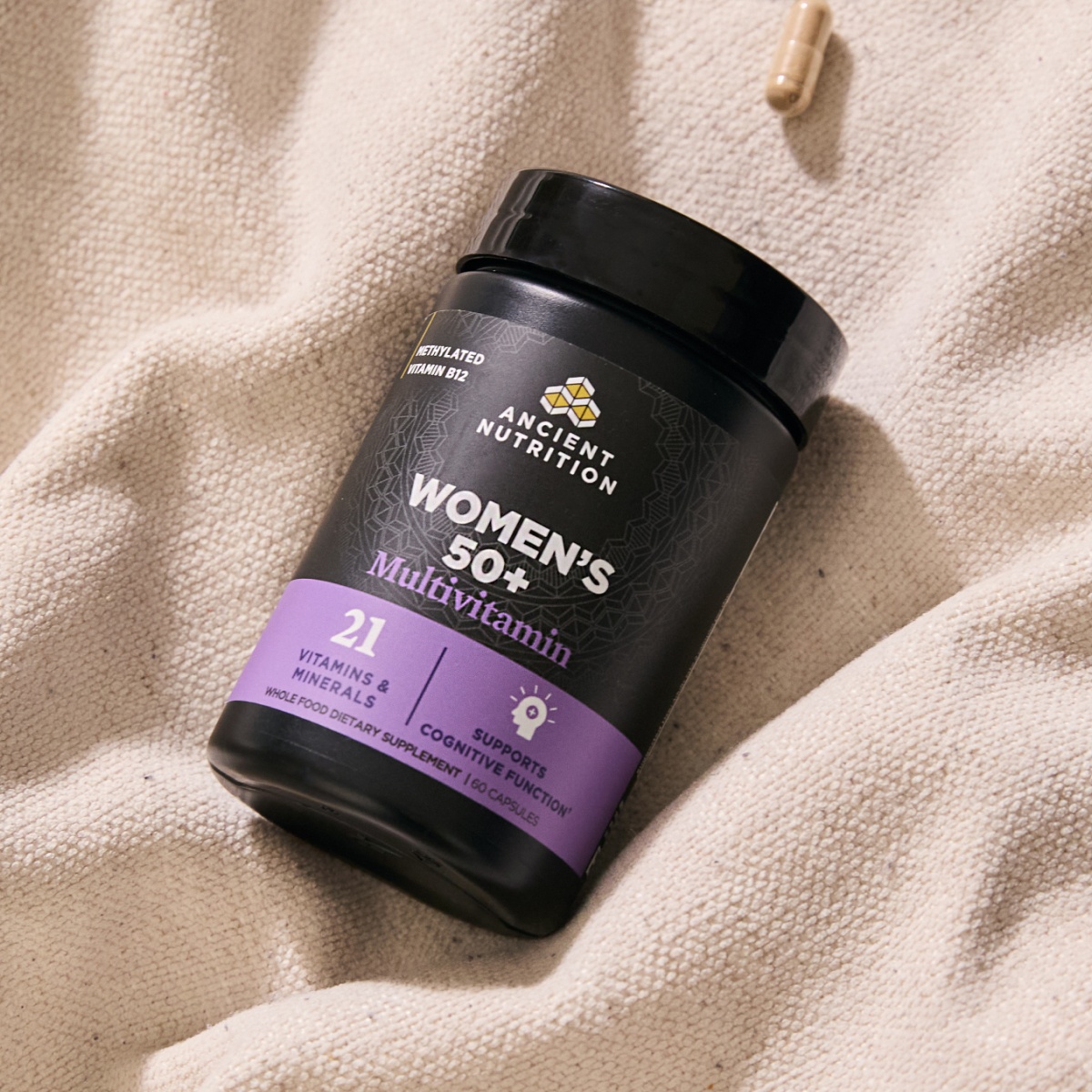 Women's 50+ Multivitamin on canvas background