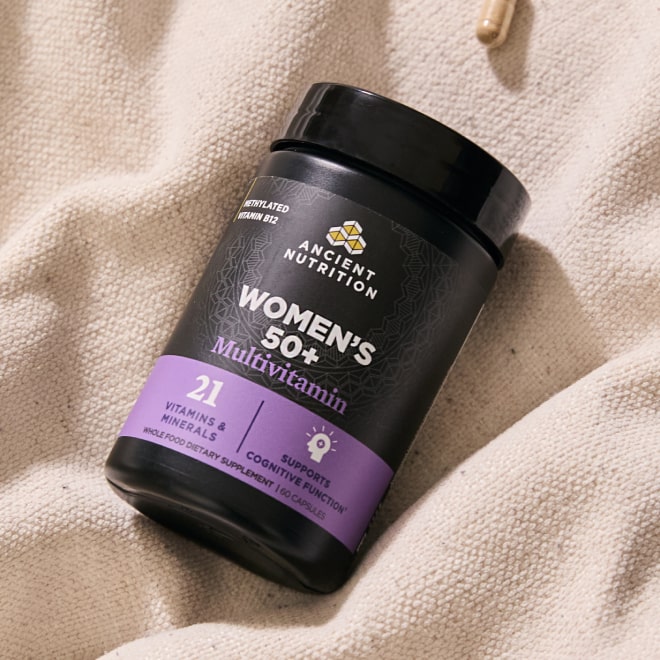 Women's 50+ Multivitamin on canvas background